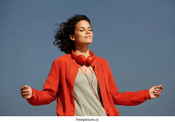 Woman enjoying music outdoors