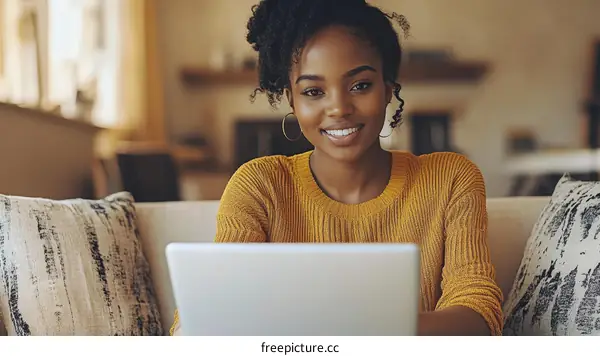 Woman Working on Laptop at Home