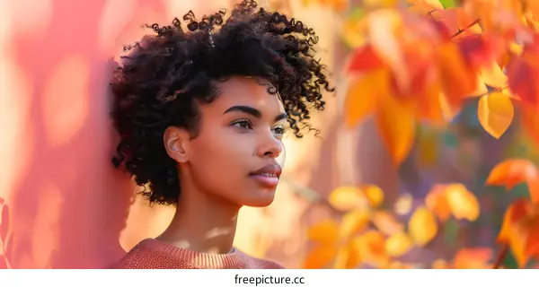 Young Woman in Autumn Leaves