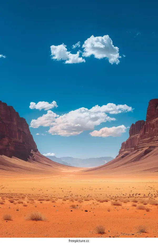 Desert Landscape with Towering Cliffs and Clear Blue Sky