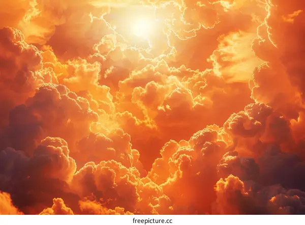 Bright orange cloudscape with sun rays shining through the clouds