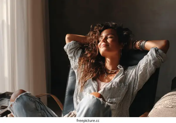 Relaxed Woman in a Chair by the Window