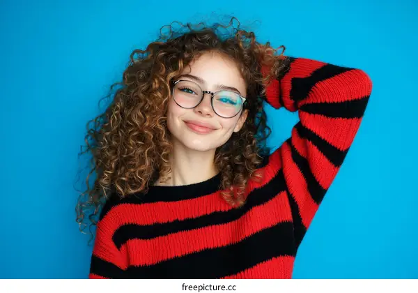 Portrait of a Curly-Haired Woman Wearing Glasses