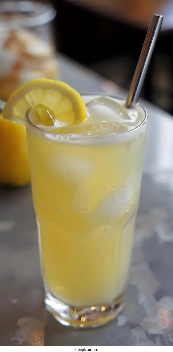 Refreshing Glass Of Lemonade With Ice And Straw
