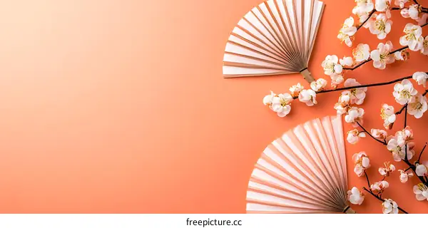 Peach Blossom and Hand Fan on Coral Background