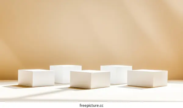 Minimalist White Display Podiums on Beige Background