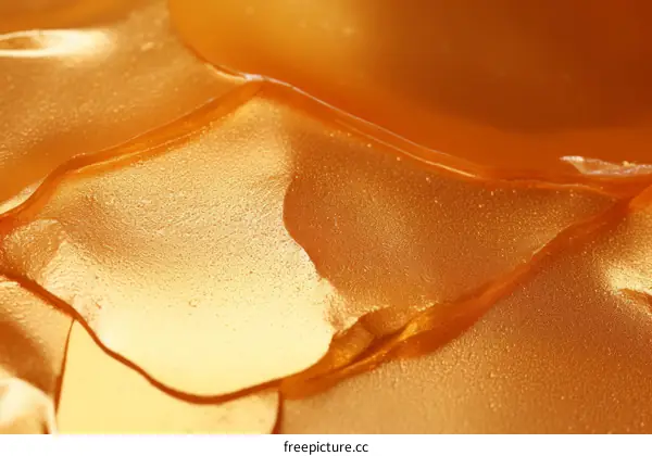 Close-up of gold paint with a smooth liquid texture