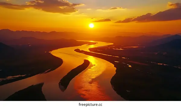 Sunset over Winding River and Mountains
