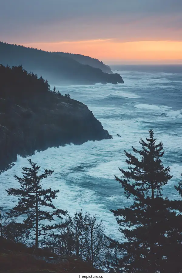 Ocean Waves Crashing Against the Rocky Coastline at Sunset