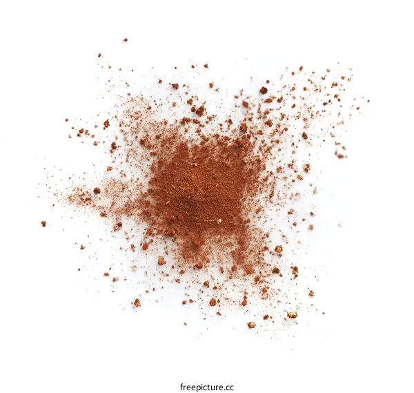 Close-up View of Brown Powder Scattered on White Background