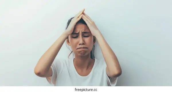 A young Asian woman is very upset and frustrated