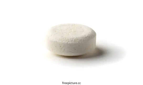 Single white pill on white background