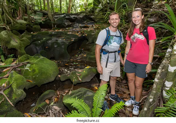 Couple Hiking Through Lush Tropical Forest in Seychelles