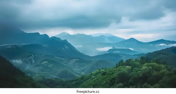 Mountain Ranges Under Cloudy Sky