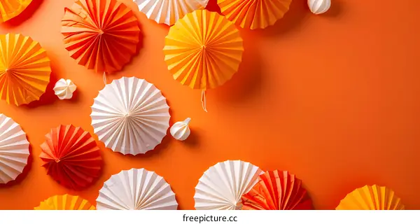Orange and White Paper Fans on Orange Background