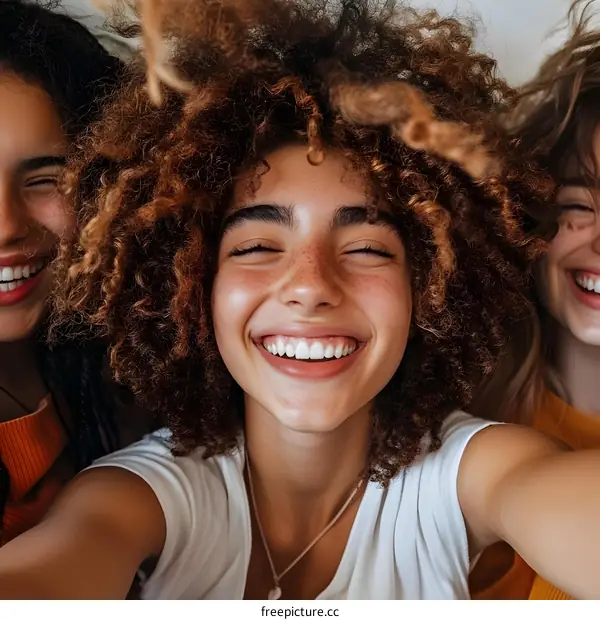 Closeup Portrait of Three Diverse Women Smiling and Taking a Selfie