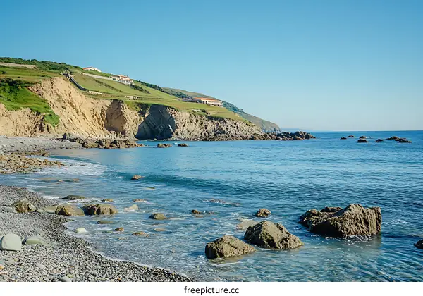 Coastal Scene with Rocky Beach and Clear Blue Water