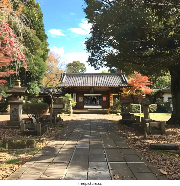A photo of a small Japanese temple with stone lanterns in the front
