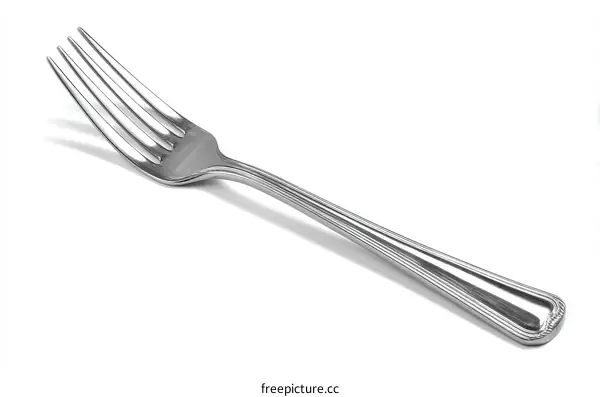 A shiny metallic dinner fork with four tines and a smooth handle