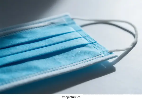 Close-up view of a blue surgical mask for protection