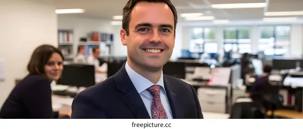 Smiling Businessman in Office Setting