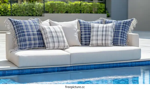 Outdoor Sofa Cushions with Plaid Design by the Pool