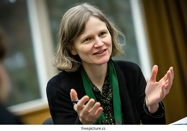 Portrait of a Woman Talking during a Conference