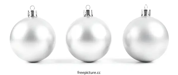 Three Silver Christmas Ornaments on a White Background