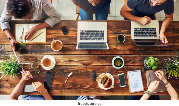 Group of People Working at a Cafe Table