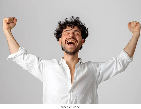 Ecstatic young middle eastern man celebrating his victory