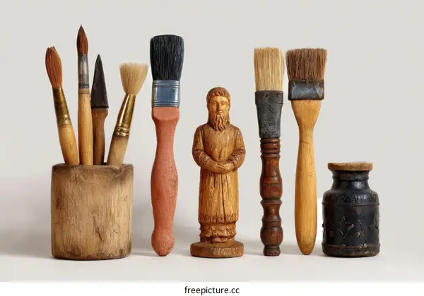 Vintage Art Brushes and a Wooden Figurine
