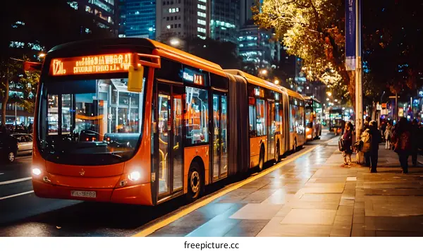 Orange Bus In City At Night
