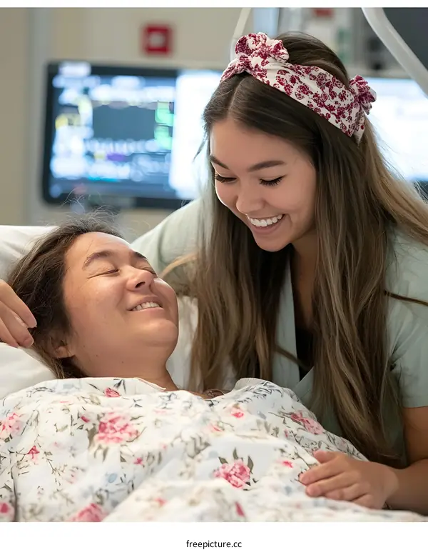 Two Women Smiling in Hospital Room