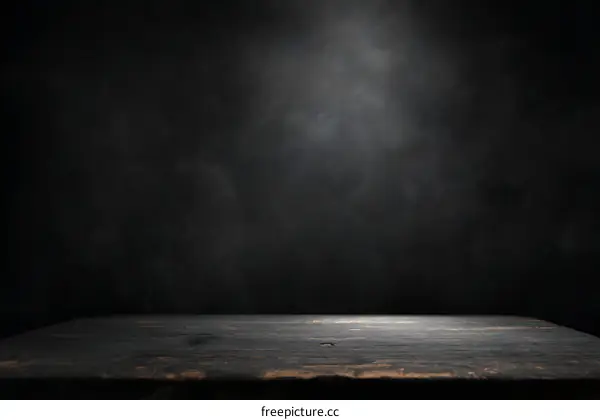 Dark Wooden Tabletop Against a Textured Dark Background