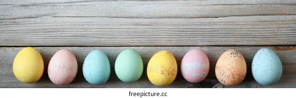 Colorful Easter Eggs on Wooden Background