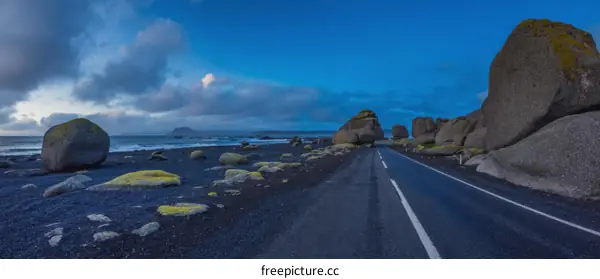 Coastal Road with Large Rocks at Dawn