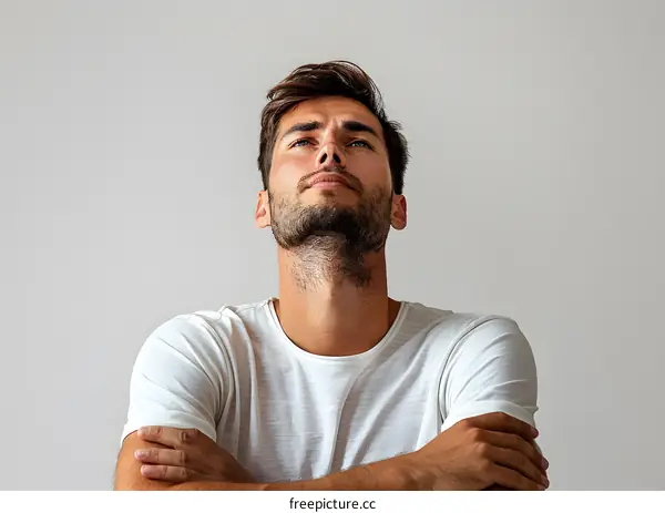 Portrait of a handsome young man looking up