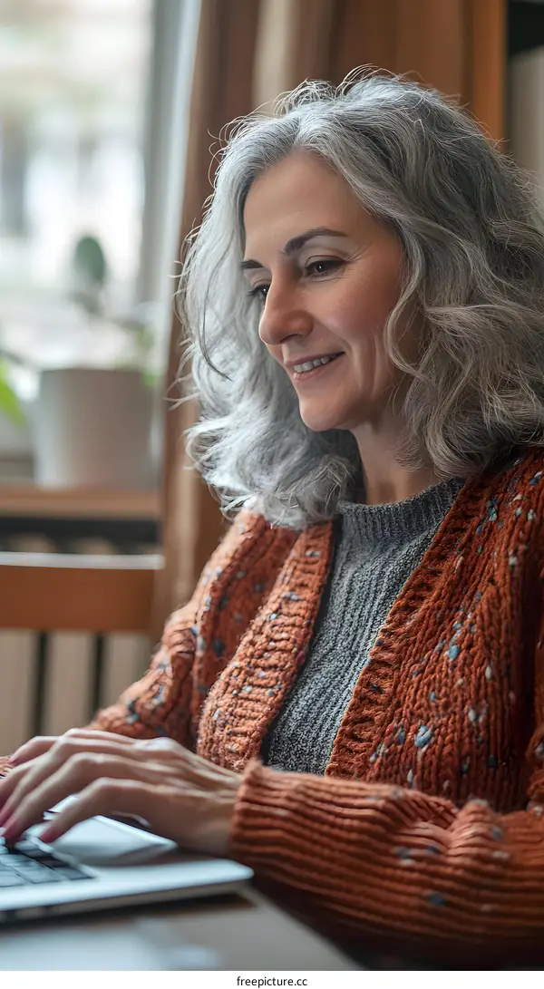 Senior Woman Working on Laptop Computer