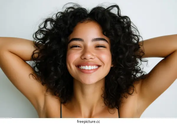Beautiful Woman with Radiant Smile and Curly Hair