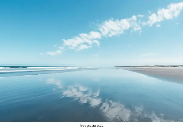 Beach with blue sky and white clouds