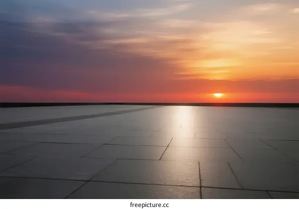 The beautiful sunset over the smooth paved ground