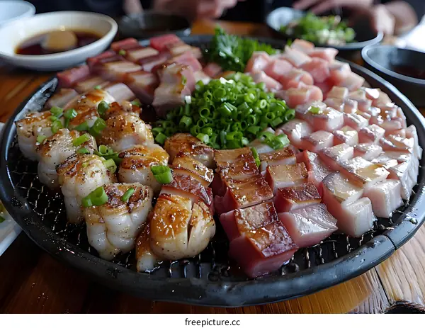 A variety of grilled meats and seafood on a table