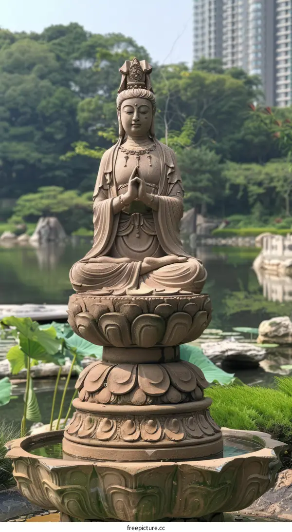 Stone statue of Kannon in a Japanese garden