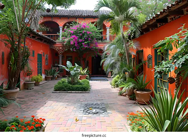 Beautiful Courtyard with Lush Greenery and Red Walls