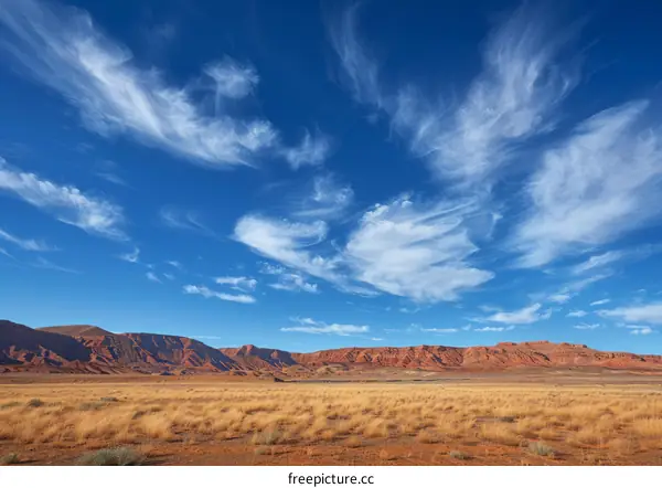Bleak and Barren Desert Outpost Amidst Expansive Azure Skies