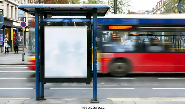 Blank Billboard at Bus Stop with Blurred Bus