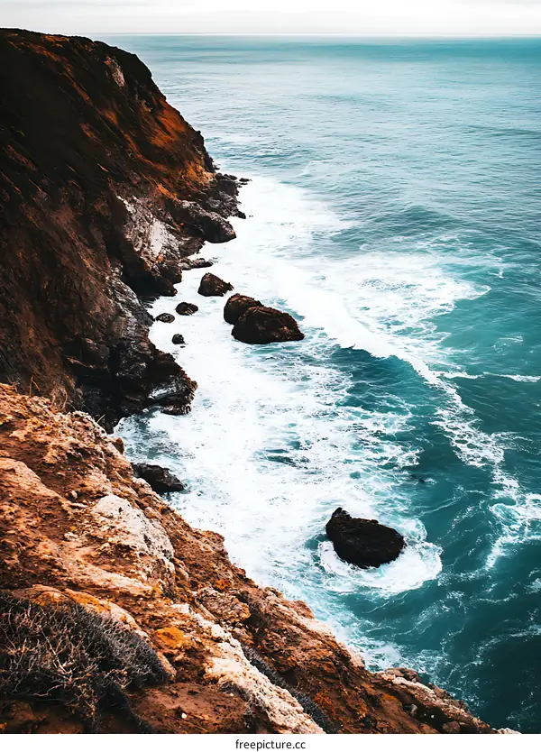 Ocean Waves Crashing Against Rocky Cliffs