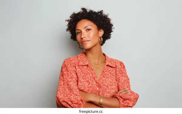 Confident Woman in Coral Print Blouse