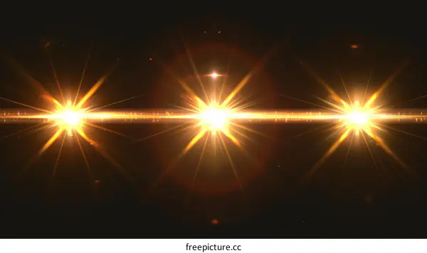 Three Bright Glowing Stars On Black Background