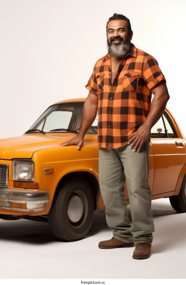 A man standing next to a yellow car